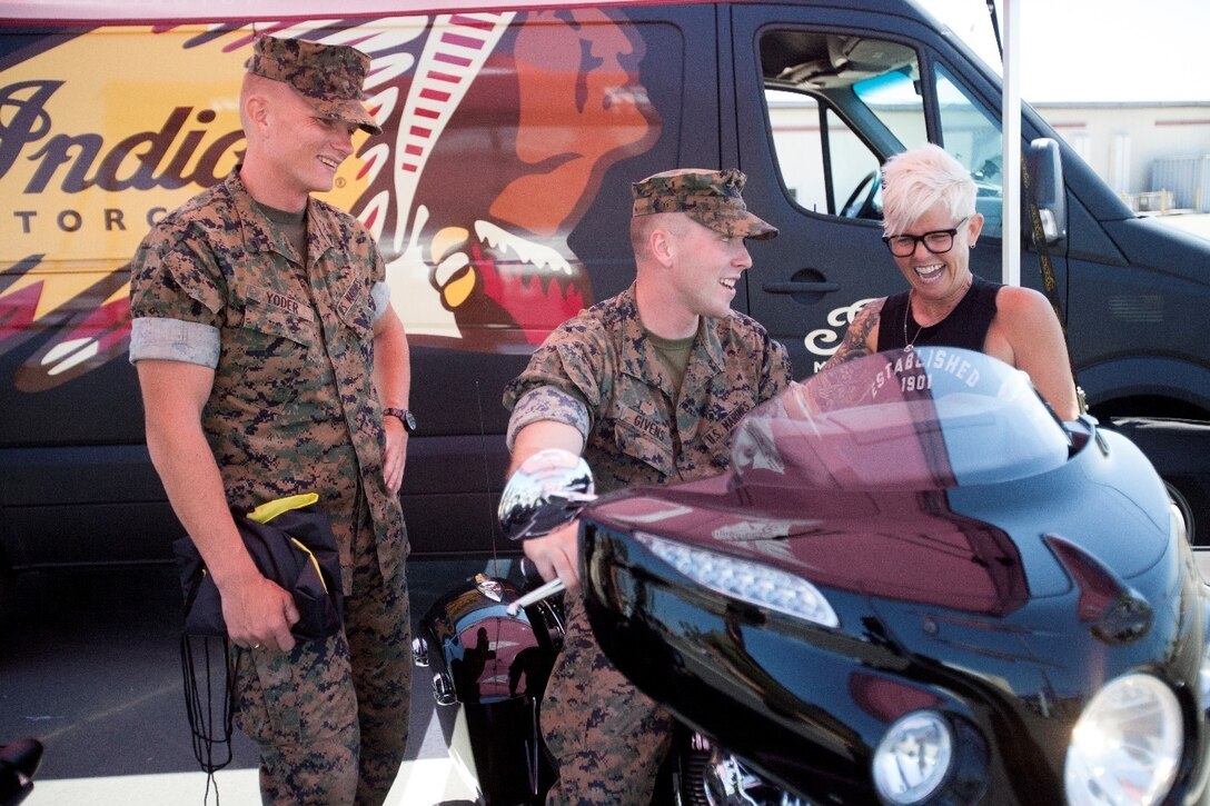 Cpl. David Yoder, left, an intelligence specialist with Marine Wing Headquarters (MWHS)-3, and Lance Cpl. Sean Givens, right, an analyst with MWHS-3, speak with a motorcycle vendor during the Semper Ride event at Marine Corps Air Station Miramar, Calif., Aug. 22. Semper Ride partners with the United States Marine Corps to increase motorcycle safety through education and training courses. (U.S. Marine Corps photo by Sgt. Shakima DePrince/Released)