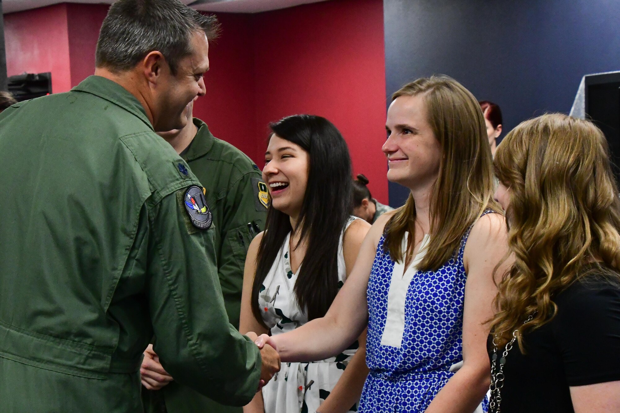 Lt. Col. William Fish, the commander of the 11th Bomb Squadron, welcomes the spouses of students graduating from Formal Training Unit Class 17-01 during the ceremony on Barksdale Air Force Base, La. Aug. 25, 2017.