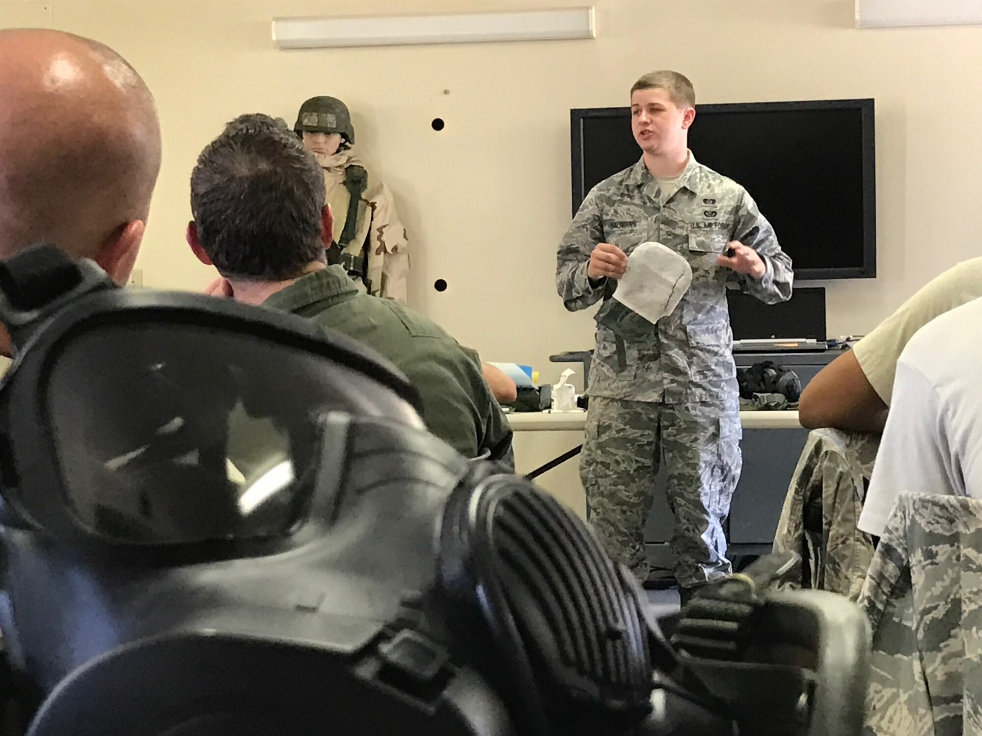 Senior Airman Joseph Bauman, 940th Civil Engineer Squadron emergency management technician, demonstrates use of the M295 Individual Equipment Decontamination Kit during chemical, biological, radiological, nuclear, and high-yield explosives training at Beale Air Force Base, California Aug. 12, 2017. This training prepares Citizen Airmen to survive and work in a hostile environments. (U.S. Air Force photo by Staff Sgt. Brenda H. Davis/Released)