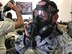 Lt. Col. Joshua Flatley, 940th Operations Support Squadron commander, drinks through his M50 gas mask during chemical, biological, radiological, nuclear, and high-yield explosives training at Beale Air Force Base, California Aug. 12, 2017. This training prepares Citizen Airmen to survive and work in a hostile environments. (U.S. Air Force photo by Staff Sgt. Brenda H. Davis/Released)