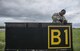 U.S. Air Force Airman 1st Class David McLemore, a 35th Civil Engineer Squadron electrician apprentice, tightens a screw on a sign at Misawa Air Base, Japan, Aug. 23, 2017. Mclemore is part of a two-man team that looks at every light on the runway, taxiway and flight line, ensuring maximum safety for every pilot who takes-off or lands. (U.S. Air Force photo by Senior Airman Brittany A. Chase)