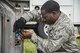 U.S. Air Force Airman 1st Class David McLemore, a 35th Civil Engineer Squadron electrician apprentice, tightens a screw on new lighting circuit board at Misawa Air Base, Japan, Aug. 23, 2017. McLemore is a part of a two-man team who look at every light on the runway, taxiway and flight line, ensuring maximum safety for every pilot who takes-off or lands. The two work with airfield management and the tower to send power to each of the different lighting components to ensure all lights are fully functional. (U.S. Air Force photo by Senior Airman Brittany A. Chase)