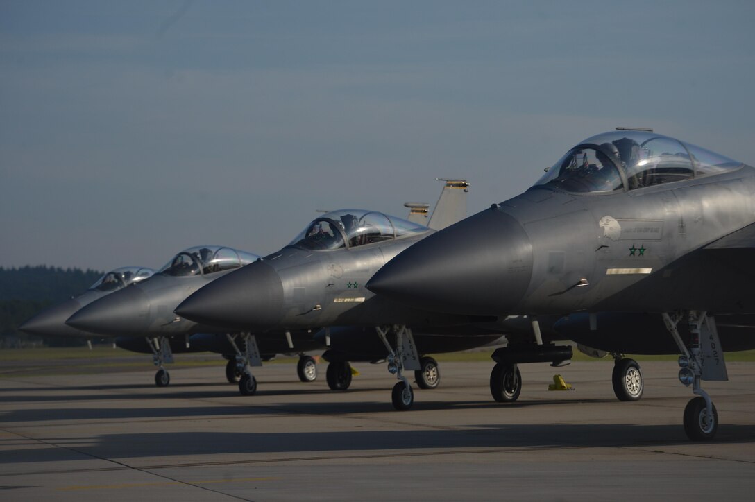 F-15C Eagles from the 493rd Fighter Squadron prepare to depart Royal Air Force Lakenheath, England, Aug. 29, 2017. The 48th Fighter Wing has deployed approximately 140 Airmen and seven F-15C Eagles to Siauliai Air Base, Lithuania to assume control of the NATO Baltic Air Policing peacetime collective defense mission.(U.S. Air Force photo/Master Sgt. Eric Burks)