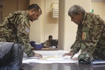 Afghan National Army soldiers with 215th Corps discuss tactics for ongoing clearing procedures during Operation Maiwand Five at Camp Shorabak, Afghanistan, Aug. 26, 2017. U.S. advisors with Task Force Southwest are assisting their Afghan counterparts throughout the operation as a means to deny safe haven to insurgency in the Nawa district of Helmand Province, Afghanistan, and promote security and Afghan governmental influence in the area. (U.S. Marine Corps photo by Sgt. Lucas Hopkins)