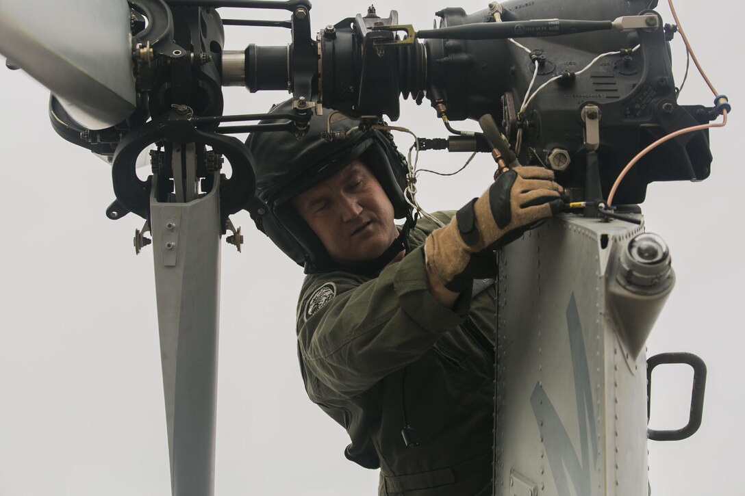 Capt. Phillip Lyon, a maintenance officer with Detachment A, Marine Light Attack Helicopter Squadron 773, Marine Aircraft Group 49, 4th Marine Aircraft Wing, Marine Forces Reserve, prepares Bell UH-1Y Venom for takeoff in support of rescue mission in wake of Hurricane Harvey, Aug. 28. 2017, from Belle Chasse, Louisiana.