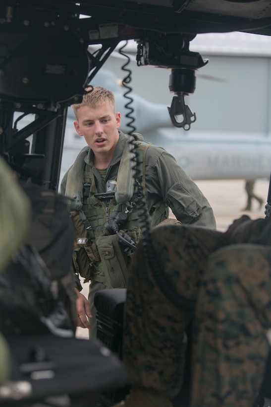Lance Cpl. Andrew Gregory, a crew chief with Detachment A, Marine Light Attack Helicopter Squadron 773, Marine Aircraft Group 49, 4th Marine Aircraft Wing, Marine Forces Reserve, prepares for takeoff in support of rescue mission in wake of Hurricane Harvey, Aug. 28, 2017, from Belle Chasse, Louisiana.