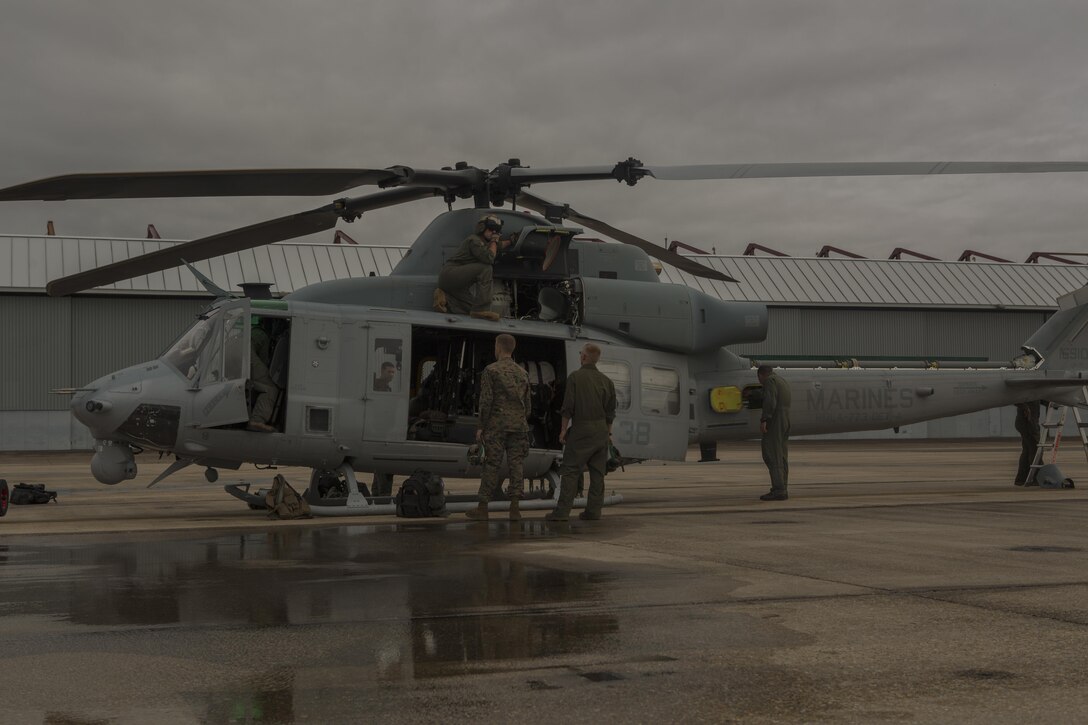 Marines from Detachment A, Marine Light Attack Helicopter Squadron 773, Marine Aircraft Group 49, 4th Marine Aircraft Wing, Marine Forces Reserve, conduct a flight pre-check on a Bell UH-1Y Venom before taking off in support of hurricane Harvey on Aug. 28, 2017 from Belle Chasse, La.