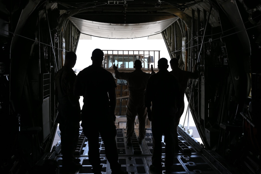 U.S. Marine Gunnery Sgt. Gregory Melson, a crew master with Marine Aerial Refueler Transport Squadron-352, Special Purpose Marine Air-Ground Task Force — Crisis Response — Central Command, guides a package onto a KC-130J Super Hercules in preparation for an air delivery exercise. Air delivery is a capability SPMAGTF CR-CC can employ that allows supplies to be delivered to ground troops when they are in remote locations, increasing SPMAGTF-CR-CC’s ability to support itself in austere expeditionary environments.