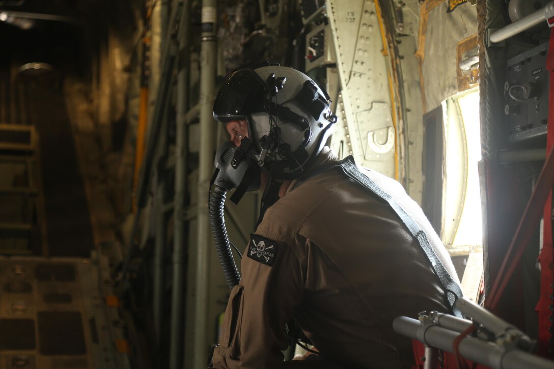 U.S. Marine Gunnery Sgt. Gregory Melson, a crew master with Marine Aerial Refueler Transport Squadron-352, Special Purpose Marine Air-Ground Task Force — Crisis Response — Central Command, wears an oxygen mask at 10,000 feet during an air delivery exercise. Air delivery is a capability SPMAGTF CR-CC can employ that allows supplies to be delivered to ground troops when they are in remote locations, increasing SPMAGTF-CR-CC’s ability to support itself in austere expeditionary environments.