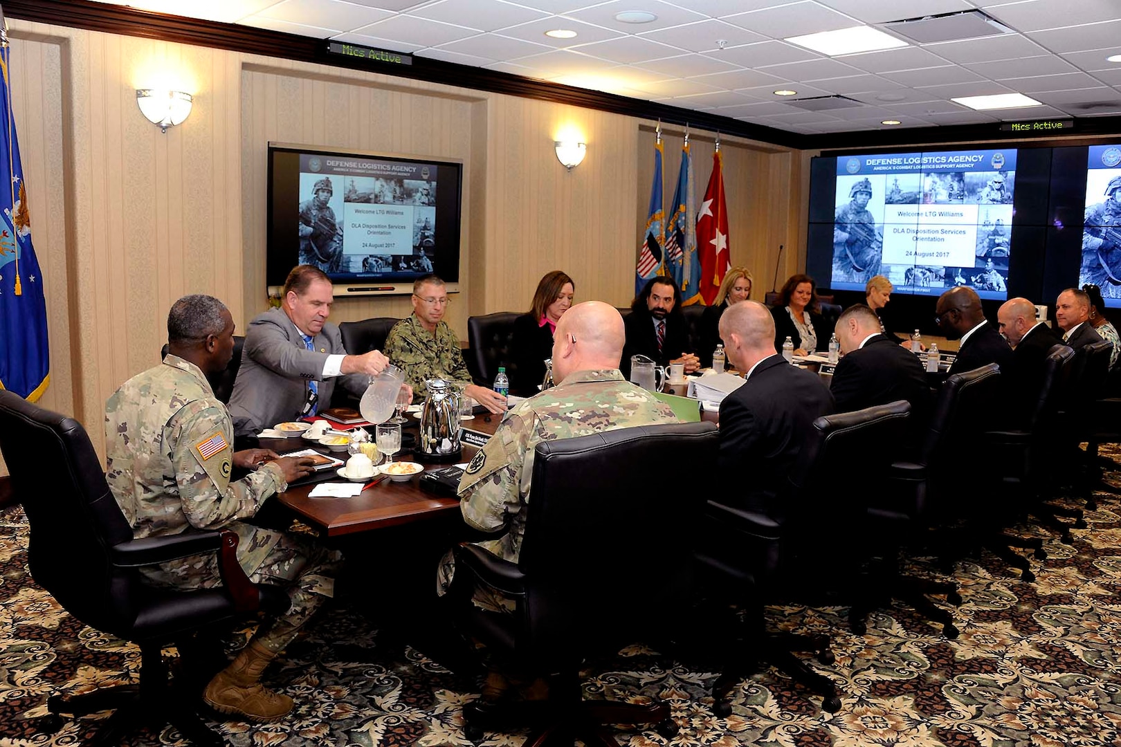 DLA Disposition Services' departmental heads and top leadership prepare to begin a comprehensive overview of the activity's mission for new DLA Director Army Lt. Gen. Darrell Williams Aug. 24.