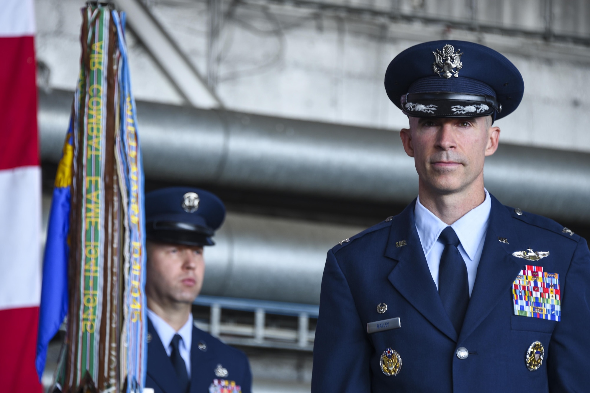 U.S. Air Force Col. Jason Bailey, incoming 52nd Fighter Wing commander, prepares to take command during the wing change of command ceremony in Hangar 1 at Spangdahlem Air Base, Germany, Aug. 29, 2017.  Bailey is a U.S. Air Force Academy graduate with more than 3,000 flying hours in multiple aircraft, including more than 600 combat hours in Iraq and Afghanistan.  (U.S. Air Force photo by Senior Airman Dawn M. Weber)