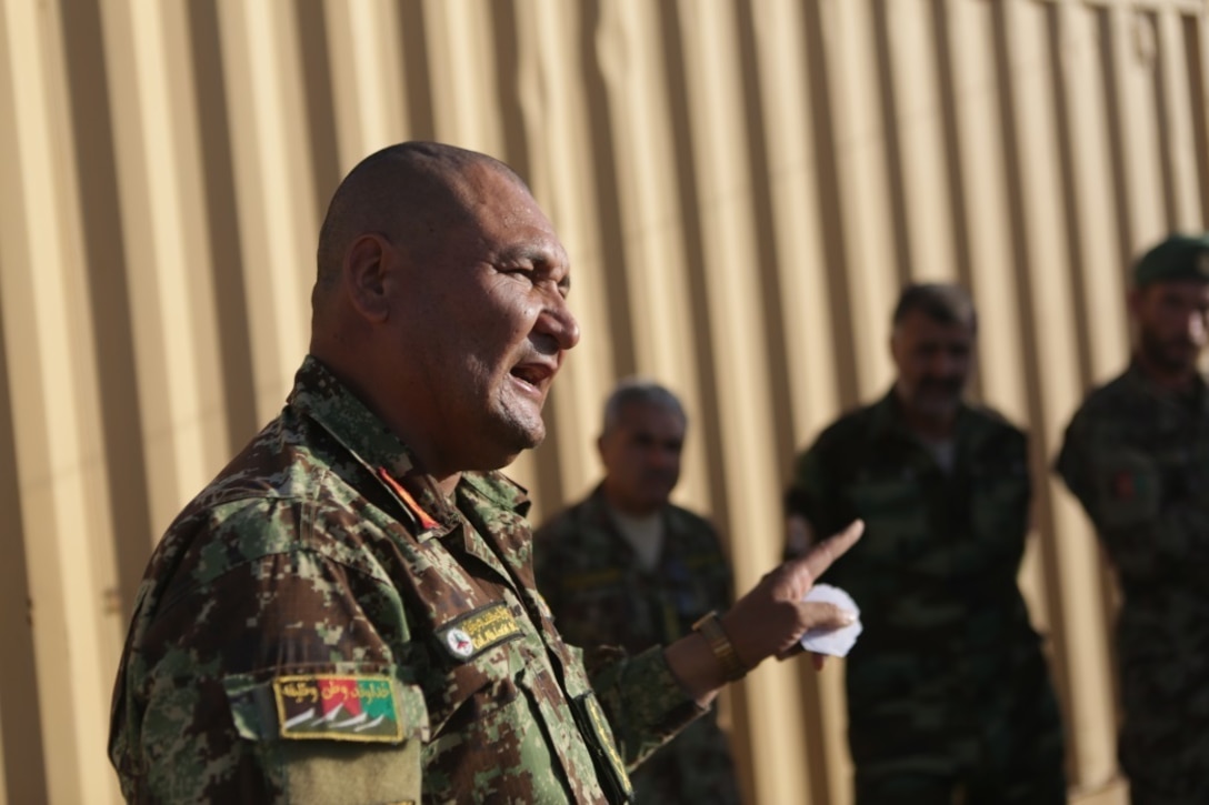 Afghan National Army Col. Abdul Latif, the operations officer of 215th Corps, briefs ANA soldiers on an upcoming mission to clear and secure the Nawa district in Helmand province during Operation Maiwand Five Aug. 21, 2017. Soldiers with 215th Corps have been training to improve their tactics and communication capabilities to enhance combat readiness during missions. U.S. advisors with Task Force Southwest are assisting their Afghan counterparts throughout the operation to deny the Nawa area as a safe haven for insurgency. (U.S. Marine Corps photo by Cpl. Tyler Harrison)