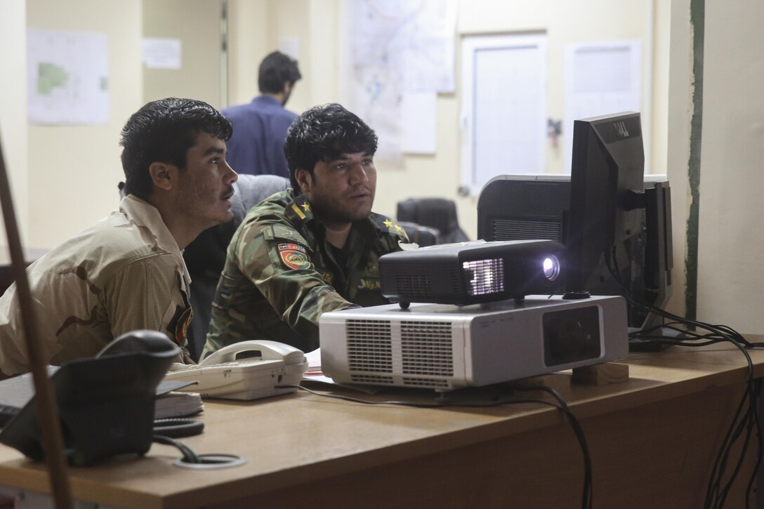 Afghan National Army soldiers with 215th Corps track troop movements in the vicinity of Nawa district in Helmand Province, Afghanistan during Operation Maiwand Five, Aug. 26, 2017. U.S. advisors with Task Force Southwest are assisting their Afghan National Defense and Security Force counterparts at several locations throughout Helmand province during the operation, which is designed to thwart insurgency from the Nawa district and enhance security and stability for the local populace. (U.S. Marine Corps photo by Sgt. Lucas Hopkins)