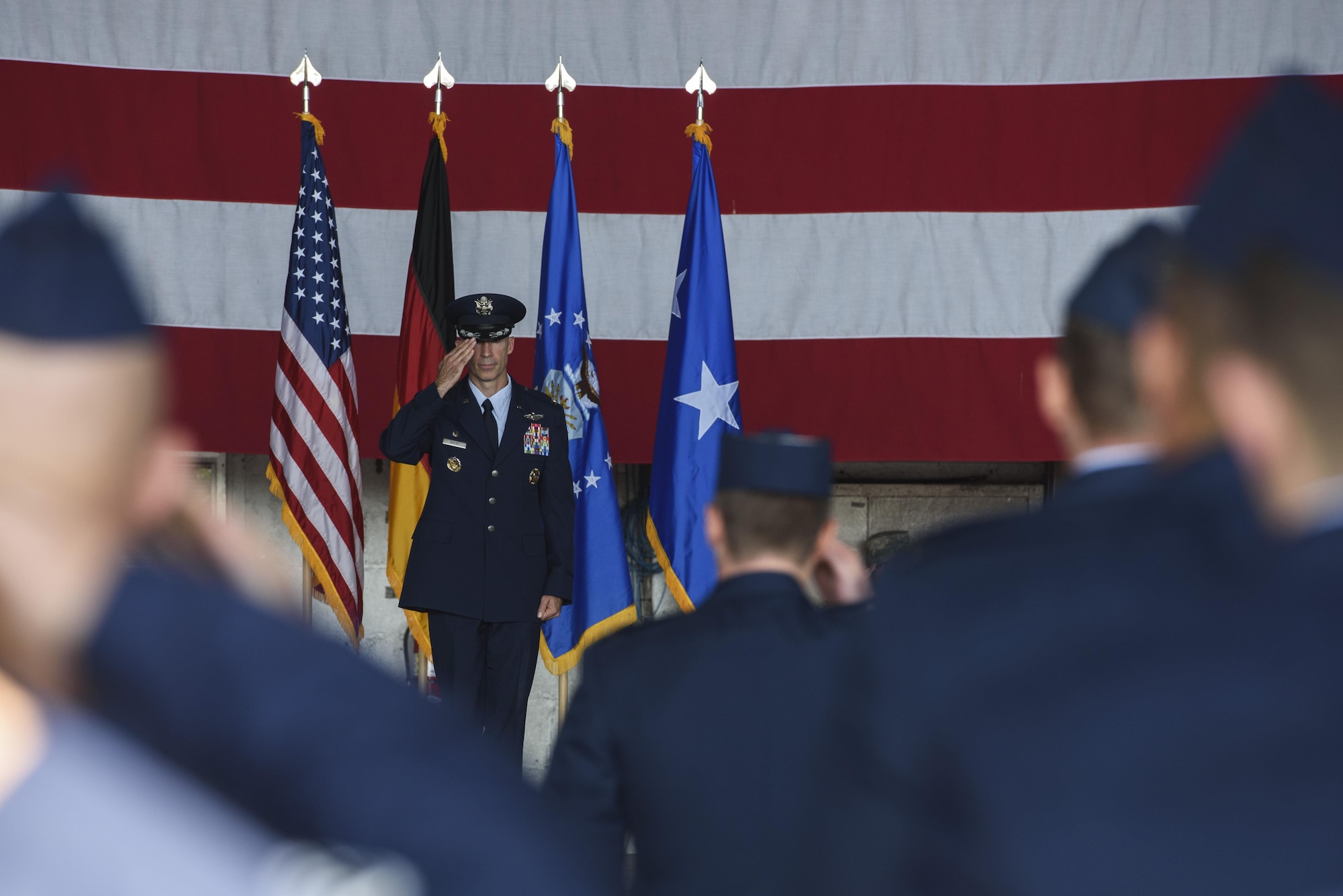 Col. Jason Bailey, 52nd Fighter Wing commander, renders his first salute as the 52nd FW commander during the change of command ceremony at Spangdahlem Air Base, Germany, Aug. 29, 2017. Bailey came from Bagram Air Field, Afghanistan, as the commander of the 455th Expeditionary Operations Group. (U.S. Air Force photo by Staff Sgt. Jonathan Snyder)