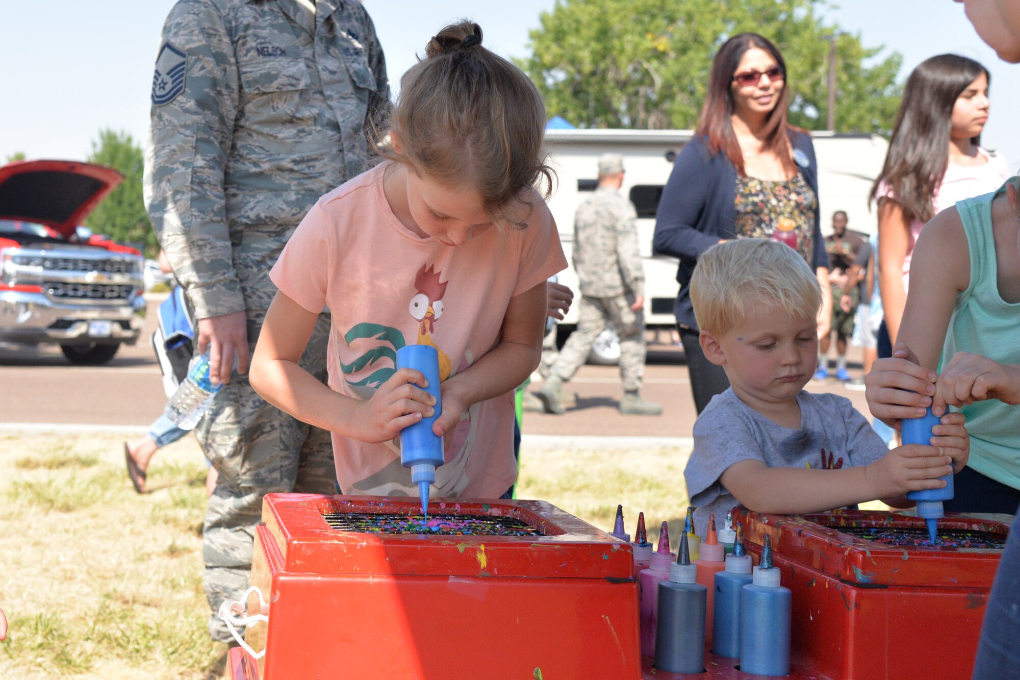 Two children paint during the annual base picnic Aug. 25, 2017, at Malmstrom Air Force Base, Mont.