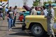 Guests view a car show during the annual base picnic Aug. 25, 2017, at Malmstrom Air Force Base, Mont. Hot dogs, hamburgers, chips and drinks were served while families roamed around the park viewing a car show and static equipment displays from maintenance, civil engineering, security forces and the 40th Helicopter Squadron. (U.S. Air Force photo/Airman 1st Class Daniel Brosam)