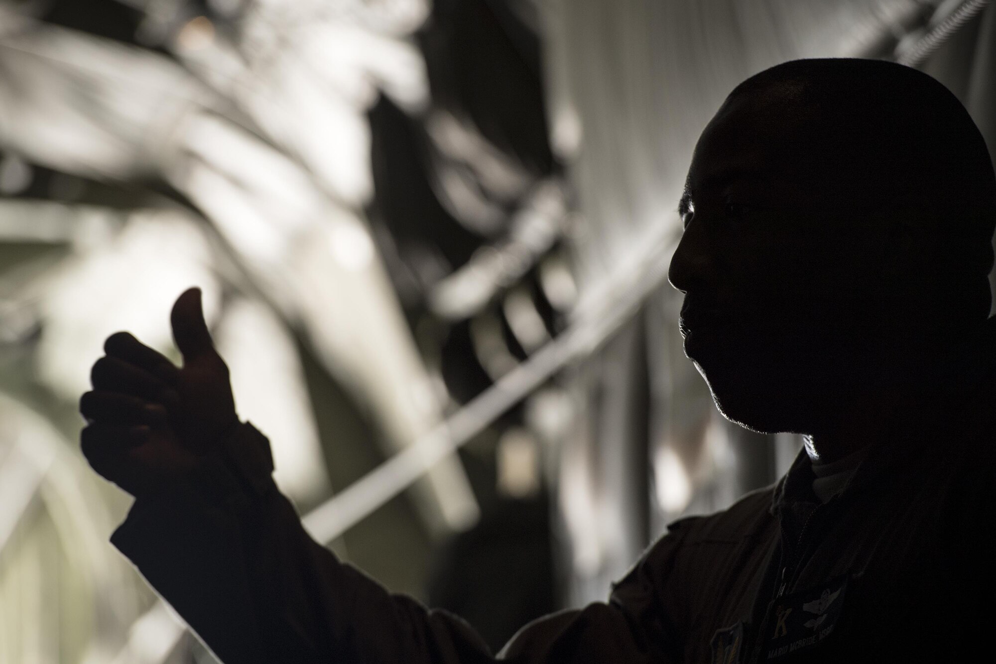 Master Sgt. McBride, 71st Rescue Squadron loadmaster, gives a thumbs up to passengers prior to taking off in an HC-130J Combat King II, Aug. 26, 2017, at Moody Air Force Base, Ga.