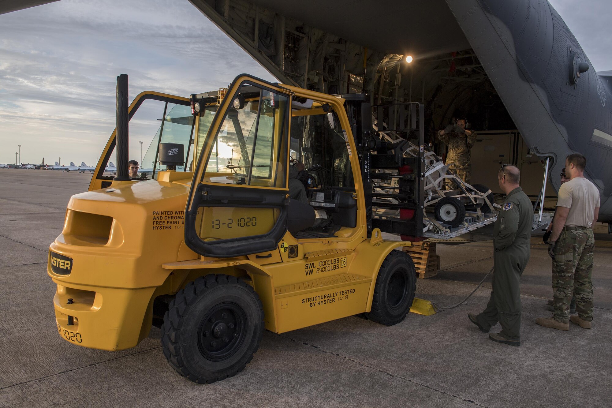 Master Sgt. McBride, 71st Rescue Squadron loadmaster unloads cargo from an HC-130J Combat King II, Aug. 26, 2017, at Naval Air Station Fort Worth Joint Reserve Base, Texas.