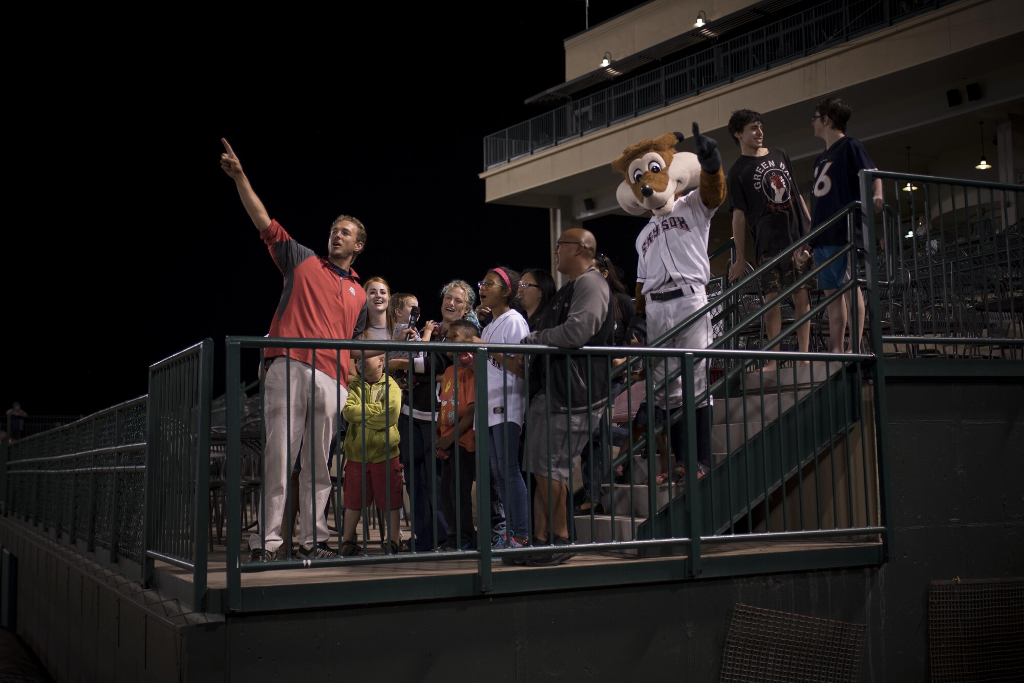 Snowball Express families attending a Snowflake Event at Security Service Field sing “Take Me Out to the Ball Game” during the seventh inning stretch at a Sky Sox baseball game in Colorado Springs, Colo., Aug. 21, 2017. Along with watching the baseball game, the children were treated to souvenirs, ice cream and autographs from Sox, the Sky Sox mascot. (U.S. Air Force photo by Senior Airman Dennis Hoffman)