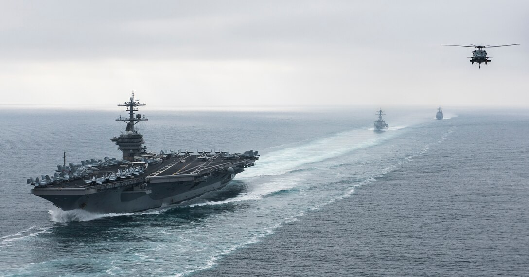 The aircraft carrier USS Theodore Roosevelt, the guided missile destroyer USS Halsey, and the guided missile cruiser USS Bunker Hill steam in formation during a strait transit show of force exercise in the Pacific Ocean, Aug. 11, 2017. The ships were preparing for an upcoming deployment. Navy photo by Petty Officer 2nd Class Paul L. Archer