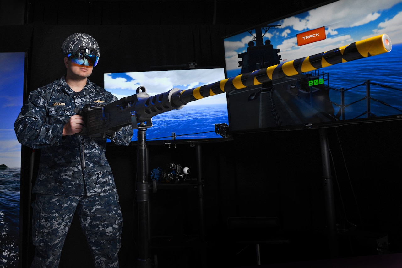 Navy Lt. Steven McGhan demonstrates a gun-augmented reality system, which was developed at the Space and Naval Warfare Systems Center Pacific in San Diego, Dec. 14, 2016. Navy photo by Alan Antczak