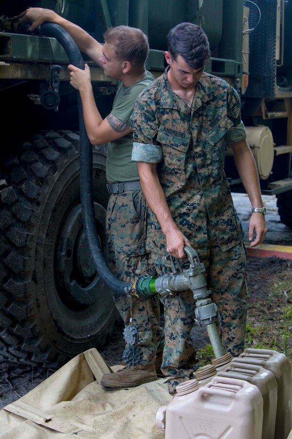 U.S. Marines with Combat Logistics Battalion 26, 26th Marine Expeditionary Unit (26th MEU), provide fuel during Realistic Urban Training (RUT) at Marine Corps Outlying Field Camp Davis - South, N.C., Aug. 19, 2017. RUT allows the 26th MEU Marines to gain operational experience working as a unit in a simulated forward-deployed environment as preparation for an upcoming deployment at sea. (U.S. Marine Corps photo by Sgt. Clemente C. Garcia)