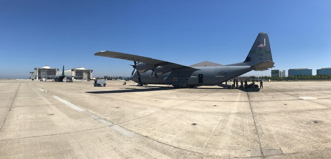 California Air National Guardsmen from the 129th Rescue Wing, Moffett Air National Guard Base, Calif., prepare to board a C-130J aircraft from the 146th Airlift Wing, Channel Island Air National Guard Station, Calif., in support of Hurricane Harvey, August 28, 2017.