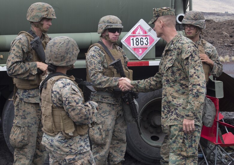POHAKULOA TRAINING AREA, HAWAII – Col. Michael Styskal, the commanding officer of 3rd Marine Regiment, meets with bulk fuel specialists at the forward arming and refueling site for Exercise Bougainville II at Pohakuloa Training Area, Aug. 21, 2017. Exercise Bougainville II prepares 3rd Battalion, 3rd Marine Regiment for service as a forward deployed force in the Pacific by training them to fight as a ground combat element in a Marine Air-Ground Task Force. (U.S. Marine Corps photo by Lance Cpl. Luke Kuennen)