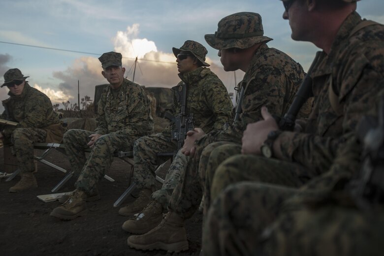 POHAKULOA TRAINING AREA, HAWAII – Lt. Gen. David Berger, the commander of U.S. Marine Corps Forces, Pacific, shares a meal in the field with Marines from Lima Company, 3rd Battalion, 3rd Marine Division, during his tour of Exercise Bougainville II at Pohakuloa Training Area Aug. 21, 2017. Berger and a party of senior leadership met with junior Marines and leadership from various units taking part in the exercise, and observed day-to-day operations. Exercise Bougainville II prepares 3rd Battalion, 3rd Marine Regiment for service as a forward deployed force in the Pacific by training them to fight as a ground combat element in a Marine Air-Ground Task Force. (U.S. Marine Corps photo by Lance Cpl. Luke Kuennen)