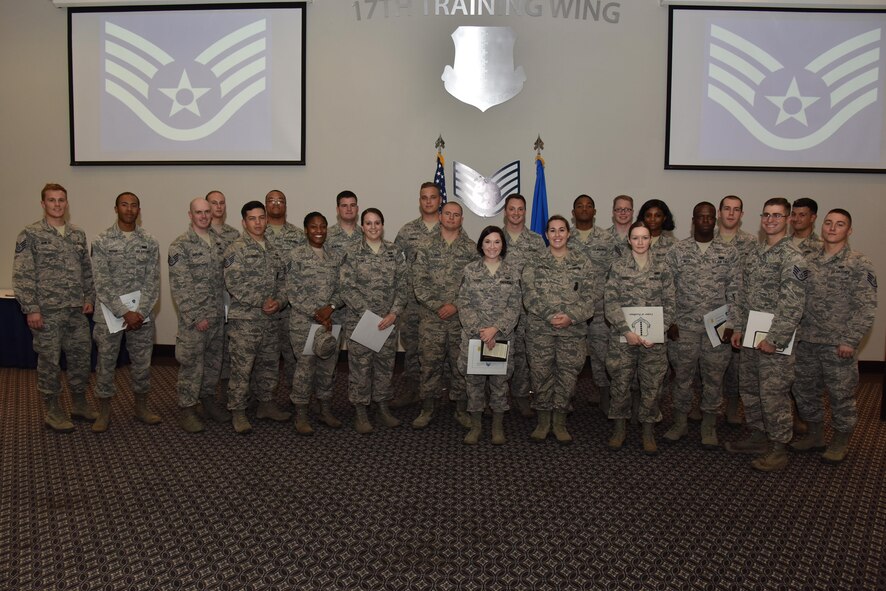 Senior airmen pose for a photo during the Staff Sergeant Release Party at the Event Center on Goodfellow Air Force Base, Texas, Aug. 24, 2017. The senior airmen will make the transition to staff sergeant though the course of the year. (U.S. Air Force photo by Staff Sgt. Joshua Edwards/Released)