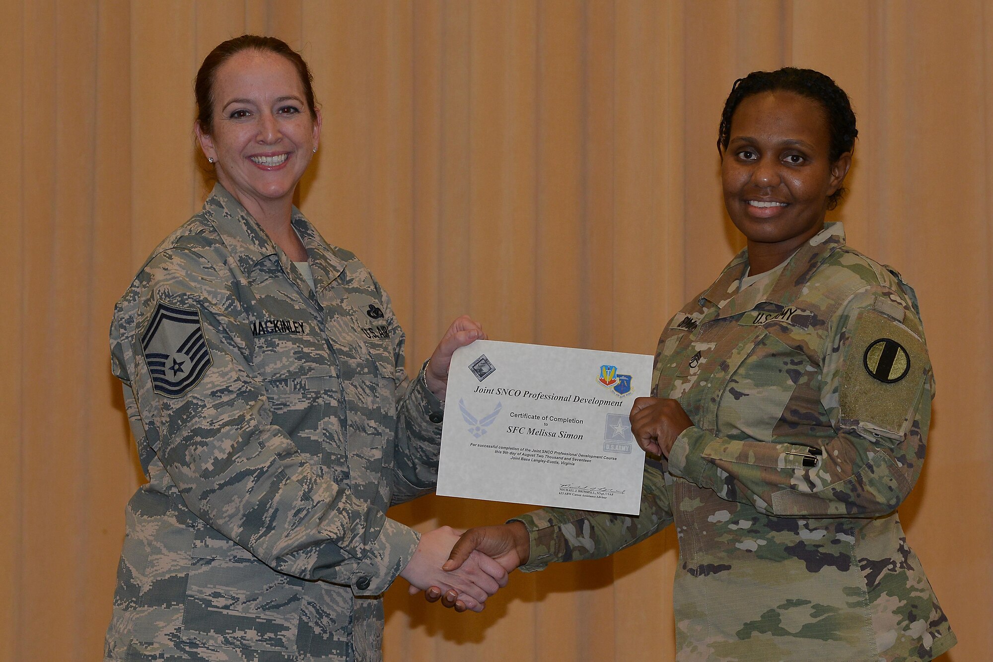 U.S. Army Sgt. 1st Class Melissa Simon, 149th Seaport Operations Company, 7th Transportation Brigade-Expeditionary operations security noncommissioned officer, receives her completion certificate from the Joint Senior Noncommissioned Officer Professional Development course at Joint Base Langley-Eustis, Va., Aug. 9, 2017.