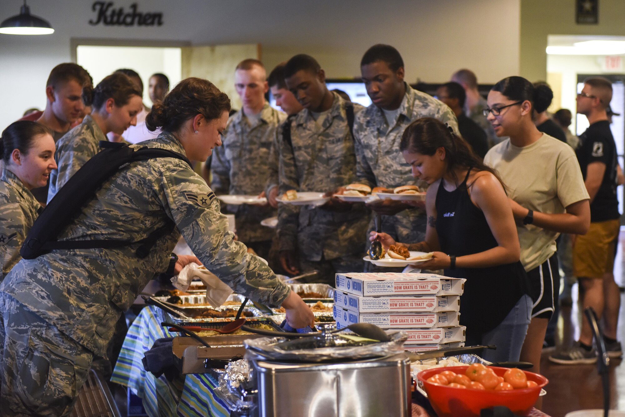 Airmen from various squadrons choose their food for the Airmen dorm dinner at the Crossroads on Goodfellow Air Force Base, Texas, Aug. 25, 2017. The free food was part of an event to show appreciation for Goodfellow students. (U.S. Air Force photo by Airman 1st Class Chase Sousa/Released)