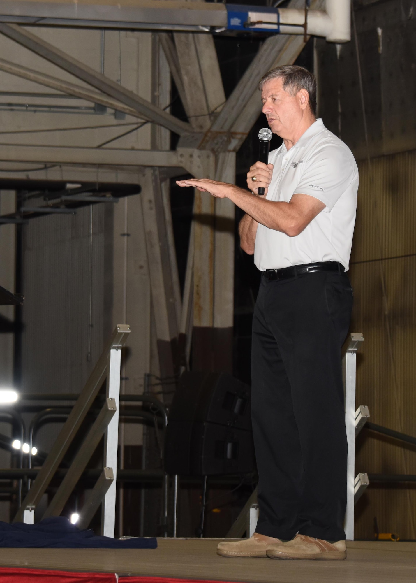 The 11th Chief Master Sergeant of the Air Force, retired, David J. Campanale, speaks to members of Grand Forks Air Force Base during an all call Aug. 25, 2017, on Grand AFB, N.D. Following his tour of the base, Campanale was scheduled to be the guest speaker at this year’s Senior NCO induction ceremony. (U.S. Air Force photo by Senior Airman Cierra Presentado)