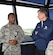 The 11th Chief Master Sergeant of the Air Force, retired, David J. Campanale, is briefed on air traffic control procedures by Airman 1st Class Horace Lawson, 319th Operations Support Squadron air traffic controller, during a visit to the base Aug. 25, 2017, at Grand Forks Air Force Base, N.D. Following his tour of the base, Campanale was the guest speaker at this year’s Senior NCO induction ceremony. (U.S. Air Force photo by Senior Airman Cierra Presentado)