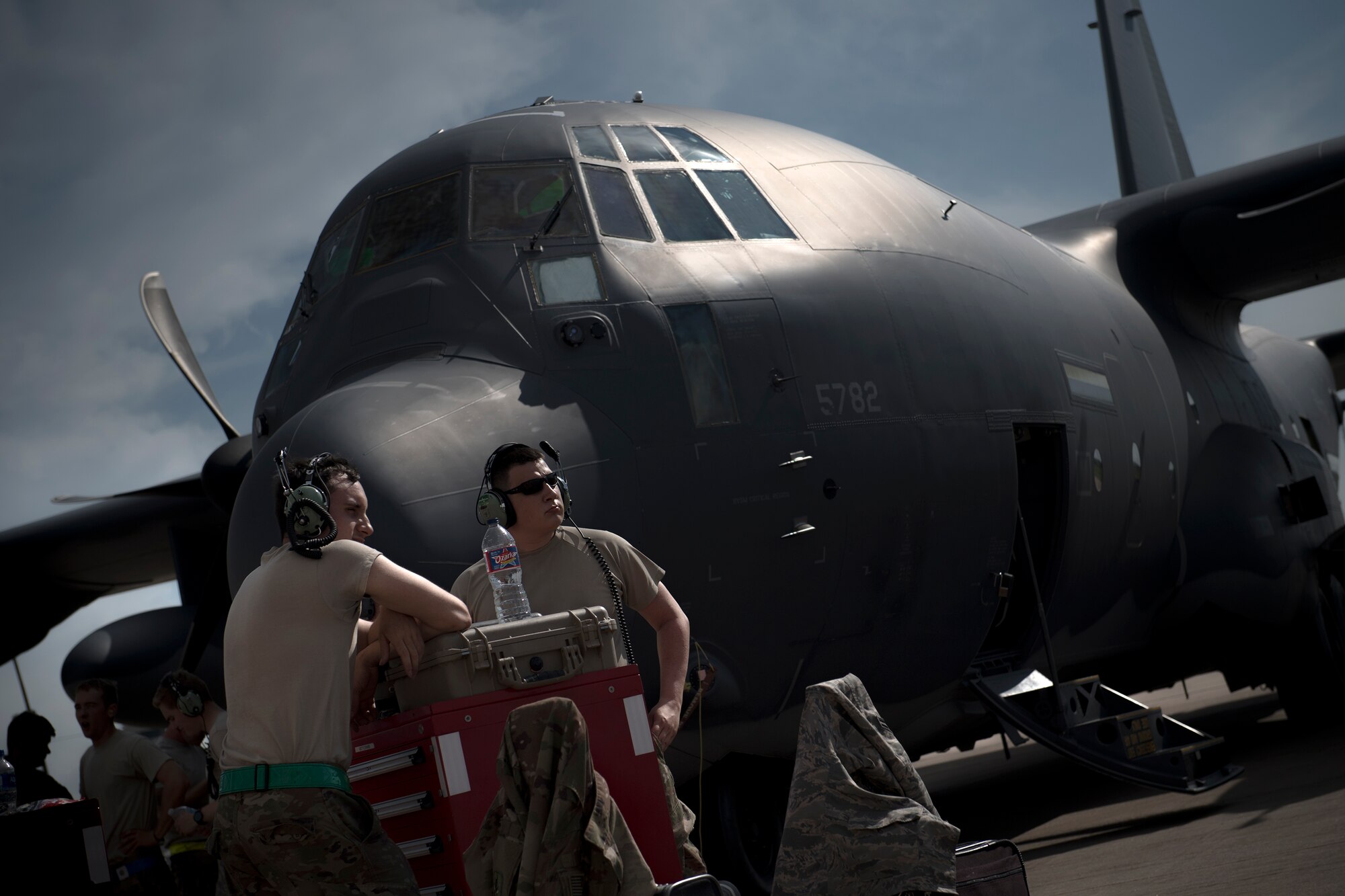 Maintainers from the 71st Aircraft Maintenance Unit standby outside an HC-130J Combat King II prior to a sortie in support of Hurricane Harvey relief efforts, Aug. 28, 2017, at Naval Air Station Fort Worth Joint Reserve Base, Texas. The 347th Rescue Group from Moody Air Force Base, Ga. sent aircraft and personnel in support of Air Forces Northern as part of Northern Command's support of FEMA's disaster response efforts. (U.S. Air Force photo by Staff Sgt. Ryan Callaghan)