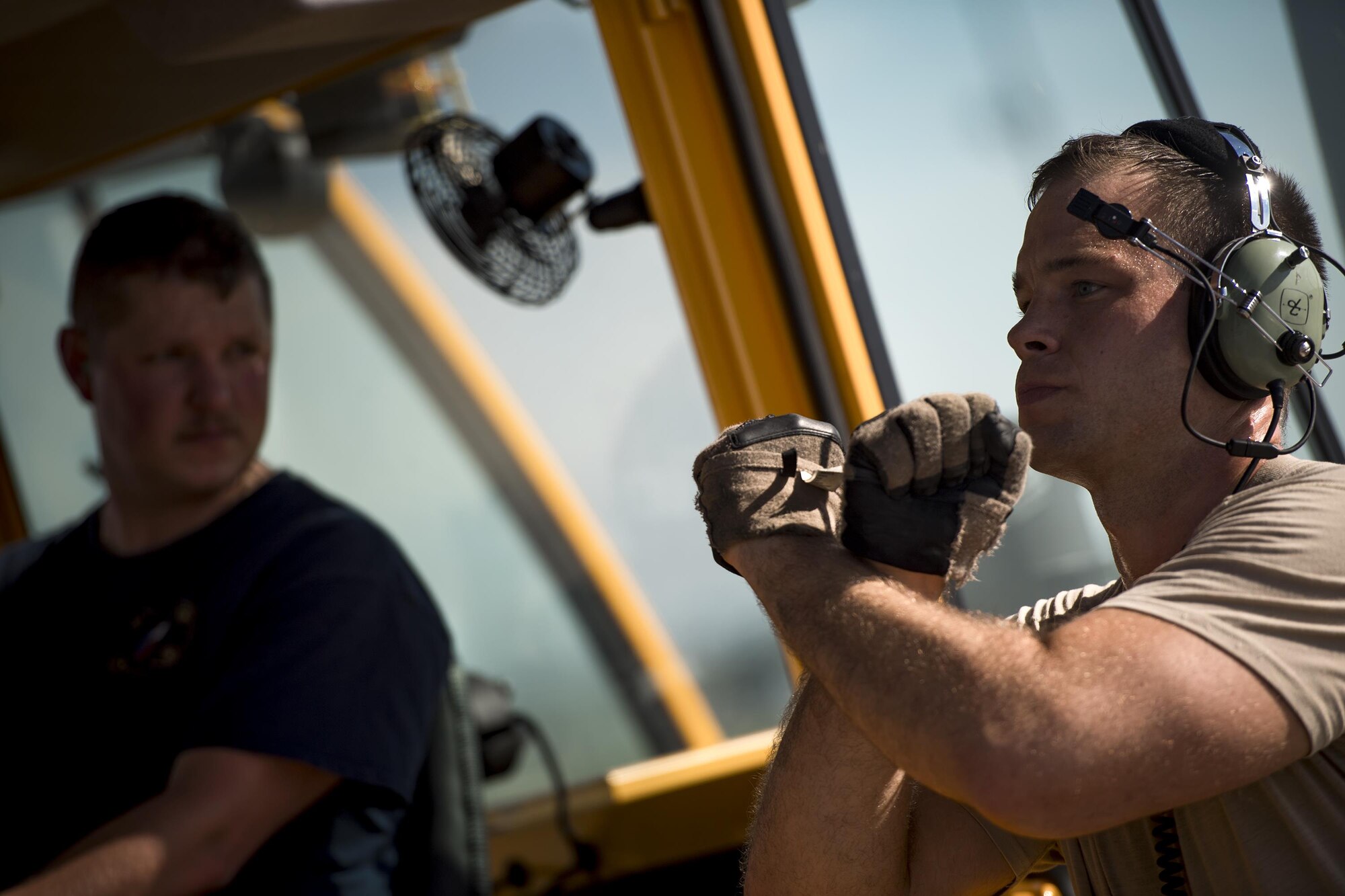 Staff Sgt. Phillip Palmer, right, 71st Rescue Squadron loadmaster, marshals a forklift driver while loading cargo onto an HC-130J Combat King II prior to a sortie in support of Hurricane Harvey relief efforts, Aug. 28, 2017, at Naval Air Station Fort Worth Joint Reserve Base, Texas. The 347th Rescue Group from Moody Air Force Base, Ga. sent aircraft and personnel in support of Air Forces Northern as part of Northern Command's support of FEMA's disaster response efforts. (U.S. Air Force photo by Staff Sgt. Ryan Callaghan)