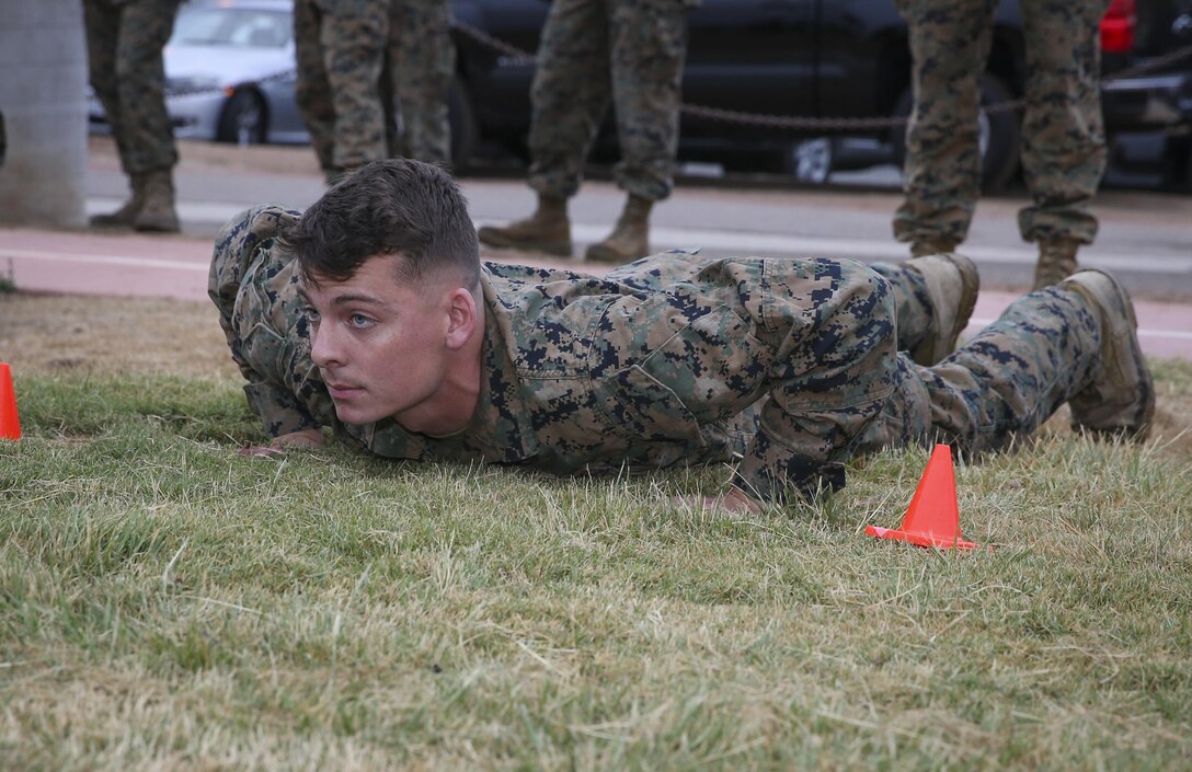 Cpl. Kristopher Trautz, an Air traffic controller with Headquarters and Headquarters Squadron (H&HS), waits in the prone position to start the maneuver under fire portion of the Warrior Challenge at Marine Corps Air Station Miramar, Calif., Aug 22.  This monthly challenge gives sections within H&HS the opportunity to work as a team and compete in several training events. (U.S. Marine Corps photo by Cpl. Andrianna Talbot/Released)