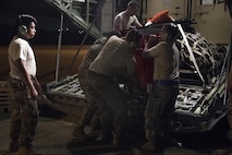 Airmen from Moody Air Force Base, Ga. unload a HC-130J Combat King II, Aug. 28, 2017, at Easterwood Airport in College Station, Texas. The 347th Rescue Group from Moody Air Force Base, Ga. sent aircraft and personnel in support of Air Forces Northern as part of Northern Command's support of FEMA's disaster response efforts. (U.S. Air Force photo by Tech. Sgt. Zachary Wolf)