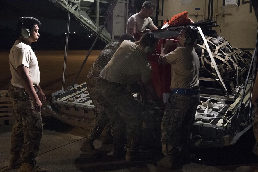 Airmen from Moody Air Force Base, Ga. unload a HC-130J Combat King II, Aug. 28, 2017, at Easterwood Airport in College Station, Texas. The 347th Rescue Group from Moody Air Force Base, Ga. sent aircraft and personnel in support of Air Forces Northern as part of Northern Command's support of FEMA's disaster response efforts. (U.S. Air Force photo by Tech. Sgt. Zachary Wolf)