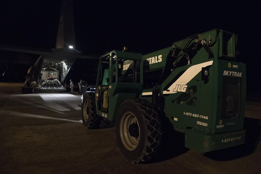 A forklift prepares to unload an HC-130J Combat King II, Aug. 28, at Easterwood Airport in College Station, Texas. The 347th Rescue Group from Moody Air Force Base, Ga. sent aircraft and personnel in support of Air Forces Northern as part of Northern Command's support of FEMA's disaster response efforts. (U.S. Air Force photo by Tech. Sgt. Zachary Wolf)