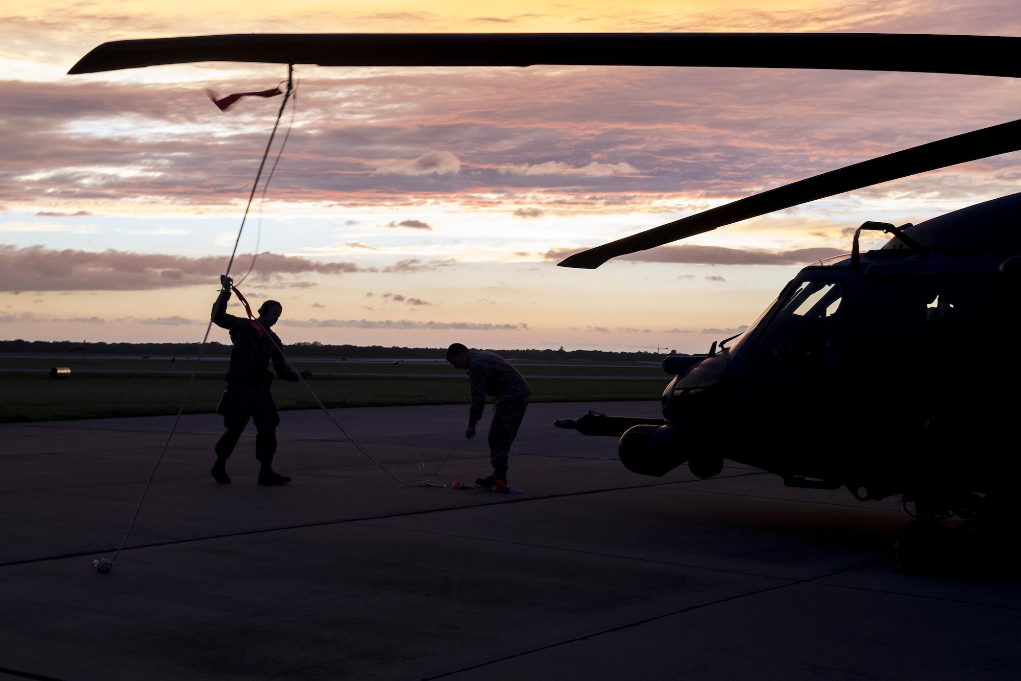 Airmen from the 41st Helicopter Maintenance Unit secure a rotor blade, Aug. 28, 2017, at Easterwood Airport in College Station, Texas. The 347th Rescue Group from Moody Air Force Base, Ga. sent aircraft and in support of Air Forces Northern as part of Northern Command's support of FEMA's disaster response efforts. (U.S. Air Force photo by Tech. Sgt. Zachary Wolf)