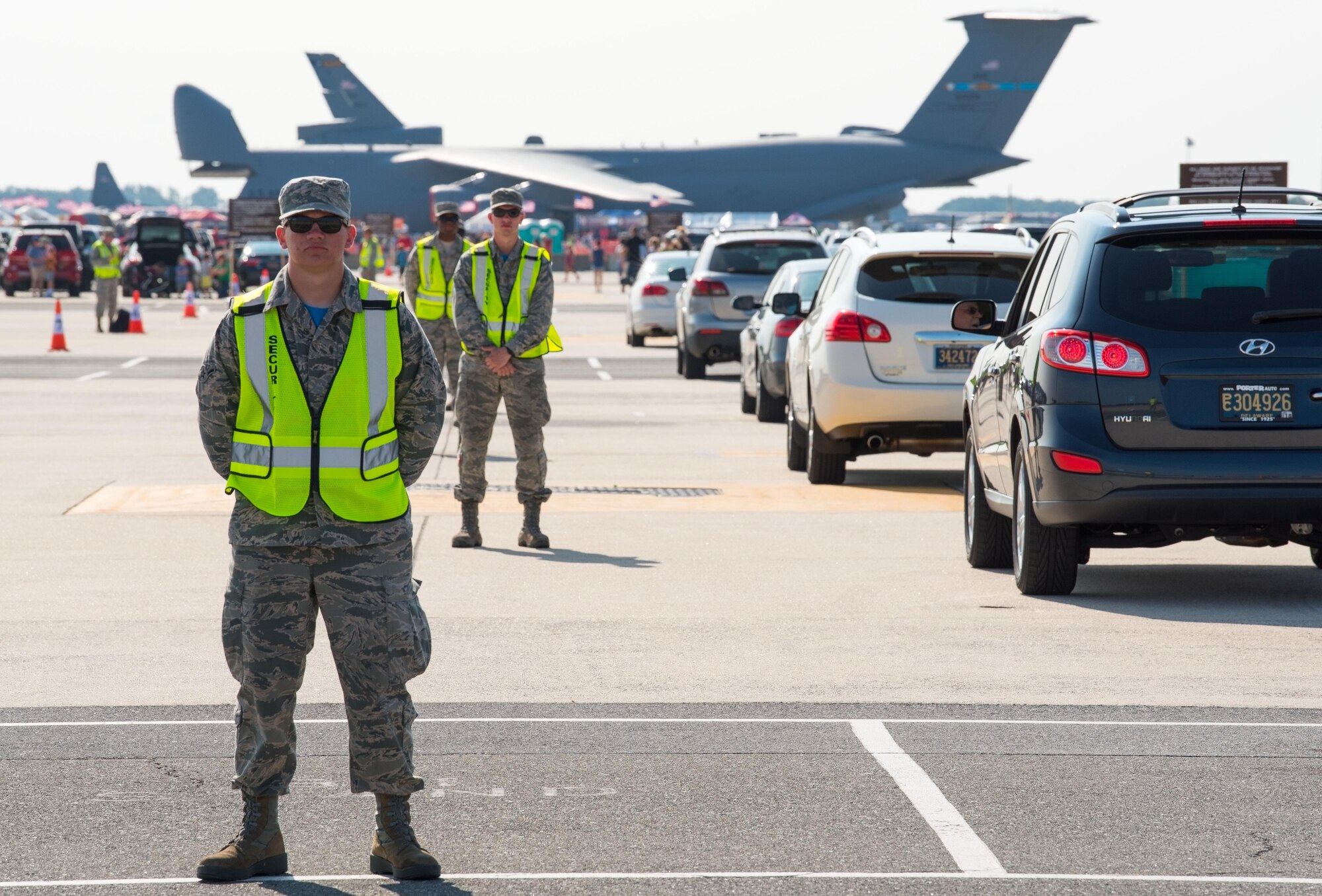 A B-2 Spirit flies overhead as Team Dover guests look on during the 2017 Thunder Over Dover Open House Aug. 26, 2017, on Dover Air Force Base, Del. The B-2 routinely conducts bomber assurance and deterrence missions providing a flexible and vigilant long-range global strike capability, and is just one demonstration of the U.S. commitment to supporting global security. (U.S. Air Force photo by Staff Sgt. Jared Duhon)