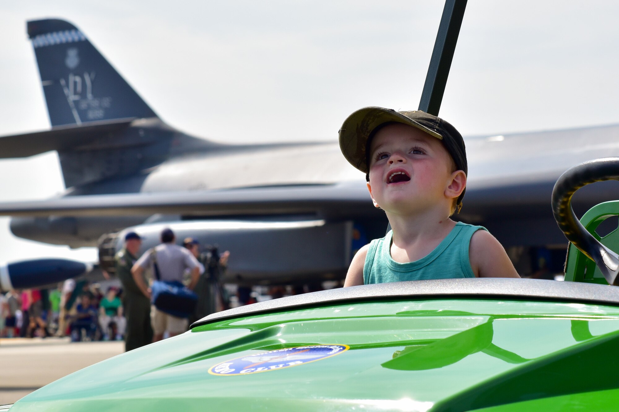 A child looks in awe at an aerial demonstration during the 2017 Thunder Over Dover Open House Aug. 25, 2017, on Dover Air Force Base, Del. The open house was a free, two-day event that featured more than 20 aerial demonstrations, static aircraft displays, and other events. (U.S. Air Force photo by Staff Sgt. Richard Mekkri)