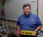 Mark Kleinman, a retired U.S. Air Force lieutenant colonel and a teacher at Travis Elementary School, poses for a photo while holding a pencil with his name on it that was given to him by one of his students at Travis Air Force Base, Calif., Aug. 25. Kleinman taught Airmen how to fly a variety of aircraft during his 33-year Air Force career and now teaches math, English language arts, science and history to 4th grade students. (U.S. Air Force photo by Tech. Sgt. James Hodgman)