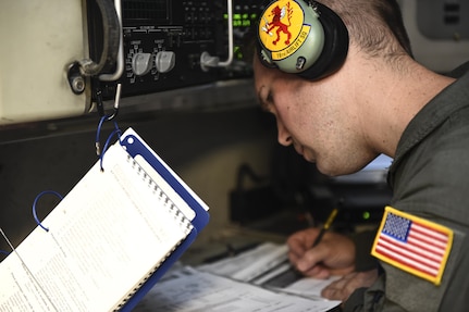 Tech. Sgt. Joe Joiner, 16th Airlift Squadron loadmaster, goes over a pre-flight checklist before flying a mission Aug. 29 to provide disaster relief to those impacted by Hurricane Harvey.