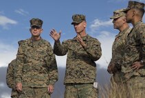 POHAKULOA TRAINING AREA, HAWAII – Col. Michael Styskal, the commanding officer of 3rd Marine Regiment, confers with Lt. Gen. David Berger, the commander of U.S. Marine Corps Forces, Pacific, at the top of Observation Post Kailua during their tour of Exercise Bougainville II at Pohakuloa Training Area Aug. 21, 2017. Berger and a party of senior leadership met with junior Marines and leadership from various units taking part in the exercise, and observed day-to-day operations. Exercise Bougainville II prepares 3rd Battalion, 3rd Marine Regiment for service as a forward deployed force in the Pacific by training them to fight as a ground combat element in a Marine Air-Ground Task Force. (U.S. Marine Corps photo by Lance Cpl. Luke Kuennen)