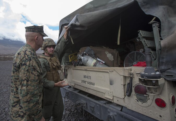 POHAKULOA TRAINING AREA, HAWAII – Sgt. Benjamin Alexander, an expeditionary fire/rescueman with Marine Wing Support Detachment 24, shows Lt. Gen David Berger, the commander of U.S. Marine Corps Forces, Pacific, the equipment used to extract an aircraft in the event of an emergency during his tour Exercise Bougainville II at Pohakuloa Training Area Aug. 21, 2017. Berger and a party of senior leadership met with junior Marines and leadership from various units taking part in the exercise, and observed day-to-day operations. Exercise Bougainville II prepares 3rd Battalion, 3rd Marine Regiment for service as a forward deployed force in the Pacific by training them to fight as a ground combat element in a Marine Air-Ground Task Force. (U.S. Marine Corps photo by Lance Cpl. Luke Kuennen)