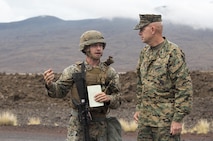 POHAKULOA TRAINING AREA, HAWAII – Cpl. Christian Warren, a bulk fuel specialist with Marine Wing Support Detachment 24, leads Lt. Gen. David Berger, the commander of U.S. Marine Corps Forces, Pacific, on a tour of the forward arming and refueling site for Exercise Bougainville at Pohakuloa Training Area Aug. 21, 2017. Berger and a party of senior leadership met with junior Marines and leadership from various units taking part in the exercise, and observed day-to-day operations. Exercise Bougainville II prepares 3rd Battalion, 3rd Marine Regiment for service as a forward deployed force in the Pacific by training them to fight as a ground combat element in a Marine Air-Ground Task Force. (U.S. Marine Corps photo by Lance Cpl. Luke Kuennen)