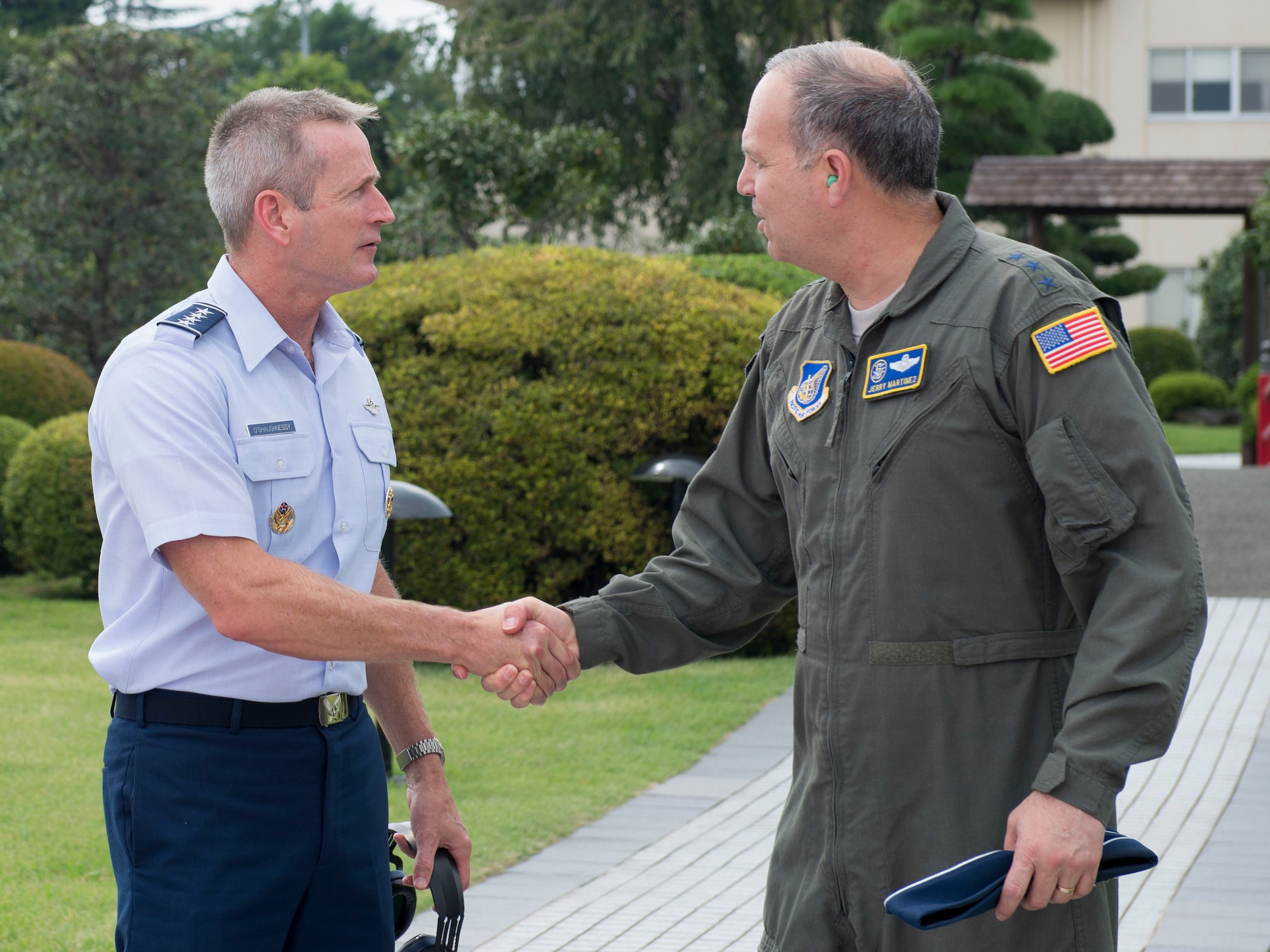 U.S. Air Force Gen. Terrence J. O’Shaughnessy, Pacific Air Forces commander, shakes hands with Lt. Gen. Jerry P. Martinez, U.S. Forces Japan and 5th Air Force commander, Aug. 30, 2017, at Yokota Air Base, Japan. O’Shaughnessy’s visit was to reaffirm the strength of the partnership between the U.S. Air Force and the Japan Air Self-Defense Force. (U.S. Air Force photo by Airman 1st Class Kevin West)