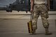 A maintainer from the 41st Helicopter Maintenance Unit waits to bring chocks to an HH-60G Pave Hawk after it completed a sortie in support of Hurricane Harvey relief efforts, Aug. 29, 2017, at Easterwood Airport, College Station, Texas. The 347th Rescue Group from Moody Air Force Base, Ga., sent aircraft and personnel in support of FEMA during Hurricane Harvey disaster response efforts. (U.S. Air Force photo by Staff Sgt. Ryan Callaghan)